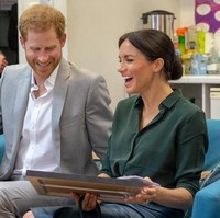 Jadi penasaran, apa yang membuat Meghan Markle sampai tertawa bahagia seperti ini? (Foto: Getty Images)