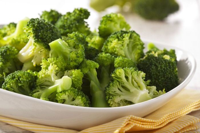 Steamed broccoli in a bowl close up