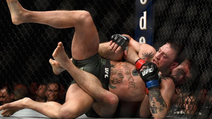 LAS VEGAS, NV - OCTOBER 06:  Khabib Nurmagomedov of Russia holds down Conor McGregor of Ireland in their UFC lightweight championship bout during the UFC 229 event inside T-Mobile Arena on October 6, 2018 in Las Vegas, Nevada.  (Photo by Harry How/Getty Images)