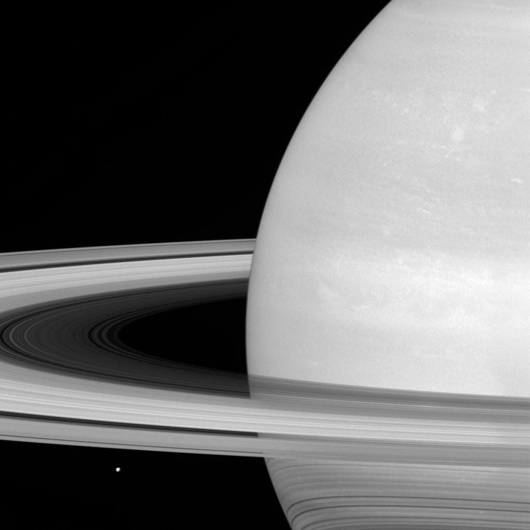 IN SPACE - JULY 21: In this handout image provided by the National Aeronautics and Space Administration (NASA), Saturns icy moon Mimas (lower L) is seen while looking toward the sunlit side of the planets rings, and was captured in red light with the Cassini spacecraft wide-angle camera on July 21, 2016. The rings, which are made of small, icy particles spread over a vast area, and are generally no thicker than the height of a house. The view was obtained at a distance of approximately 564,000 miles from Saturn. Between April and September 2017, Cassini will plunge repeatedly through the gap that separates the planet from the rings. The Cassini mission is a cooperative project of NASA, ESA (the European Space Agency) and the Italian Space Agency. (Photo by NASA/JPL-Caltech/Space Science Institute via Getty Images)