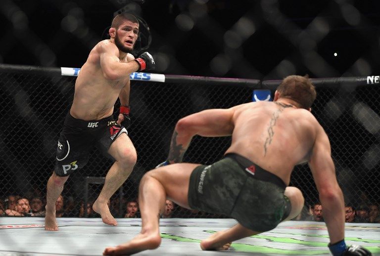 LAS VEGAS, NV - OCTOBER 06: Khabib Nurmagomedov of Russia (L) chases down Conor McGregor of Ireland in their UFC lightweight championship bout during the UFC 229 event inside T-Mobile Arena on October 6, 2018 in Las Vegas, Nevada.   Harry How/Getty Images/AFP