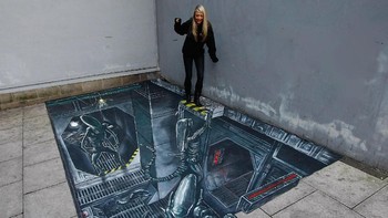 Gambar 3D di Manhchester, Inggris pada November 2010 ini terkesan membuat si gadis yang sedang berdiri di atasnya tak bisa kemana-mana lagi. (Foto: Tim Hales/Getty Images for Jameson)
