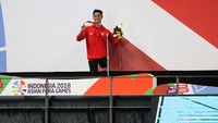 Jendi Pangabean meraih emas 100 meter gaya punggung S9 (tunadaksa) Asian Games 2018.