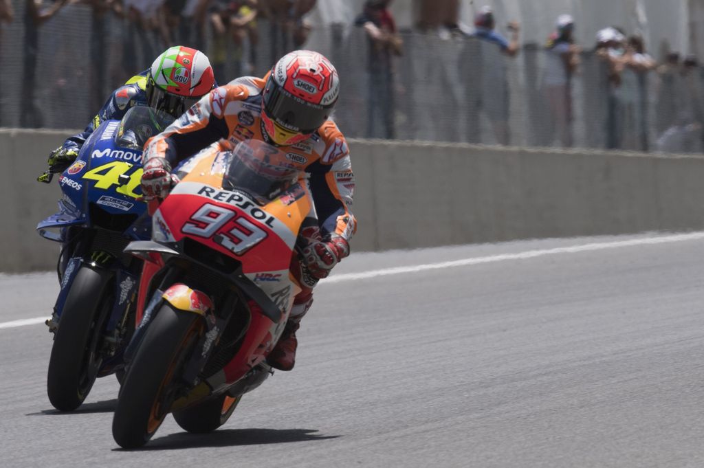 SCARPERIA, ITALY - JUNE 03: Marc Marquez of Spain and Repsol Honda Team leads Valentino Rossi of Italy and Movistar Yamaha MotoGP  during the MotoGP race during the MotoGp of Italy - Race at Mugello Circuit on June 3, 2018 in Scarperia, Italy.  (Photo by Mirco Lazzari gp/Getty Images)