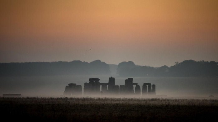 STONEHENGE, ENGLAND - OCTOBER 10:  Mist surrounds the stones at Stonehenge near Salisbury as dawn breaks on October 10, 2018 in Wiltshire, England. Many parts of the UK are experiencing temperatures almost 10C higher than average which could see the hottest October day for many years. However, the settled weather is forecast to be replaced by much more wet and windy conditions at the weekend, forcing the Met Office to issue weather warnings, as the UK braces itself for Storm CallumÂ with 80mph winds and 120mm of rain. (Photo by Matt Cardy/Getty Images)