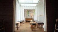 Bagian dalamnya menghadirkan area tempat duduk yang hangat dan nyaman bagi pelanggan. Istimewa/designboom.com.