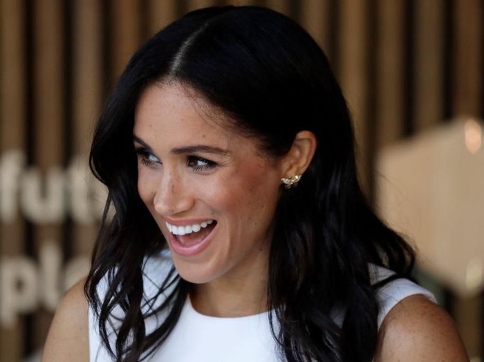 Meghan Markle tertawa lepas. Foto: Getty Images Meghan Markle tertawa lepas. Foto: Getty Images
