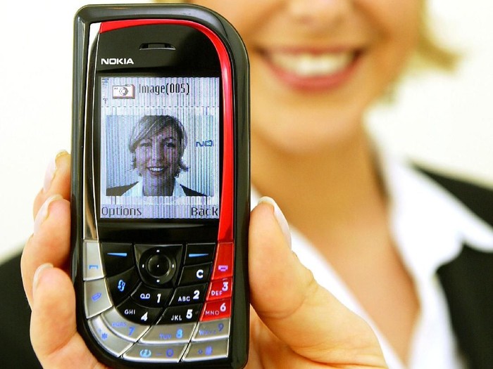 HANOVER, GERMANY - MARCH 18:  A model holds the new Nokia 7610 mobile phone at the CeBIT technology trade fair March 18, 2004 in Hanover, Germany. The 7610 is among the first phones to incorporate a high-resolution 1.0 megapixel camera and camcorder. This year a total of 6,411 exhibitors are taking part in the seven-day fair.  (Photo Sean Gallup/Getty Images)