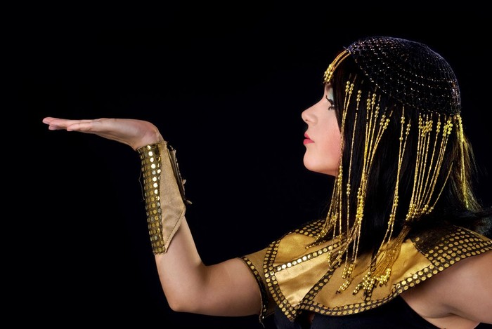 Cleopatra type woman with eyes closed.