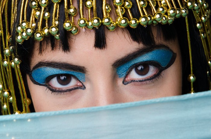 Cleopatra type woman with eyes closed.
