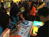 Pengunjung mencoba aaplikasi BNI Call (Foto: dok. BNI)