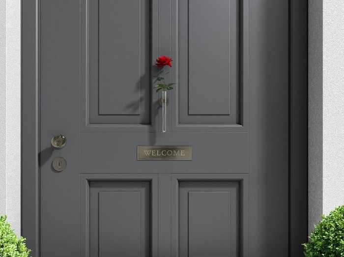 metaphorical welcome image showing a classical door with welcome sign and a red rose - rendering