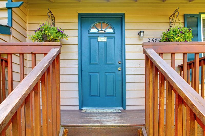 metaphorical welcome image showing a classical door with welcome sign and a red rose - rendering