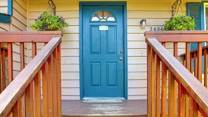 metaphorical welcome image showing a classical door with welcome sign and a red rose - rendering