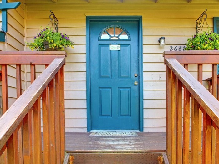 metaphorical welcome image showing a classical door with welcome sign and a red rose - rendering