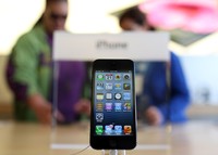 SAN FRANCISCO, CA - SEPTEMBER 21:  A new iPhone 5 is displayed at an Apple Store on September 21, 2012 in San Francisco, California. Customers flocked to Apple Stores across the U.S. to purchase the hotly anticipated iPhone 5 which went on sale nationwide today.  (Photo by Justin Sullivan/Getty Images)