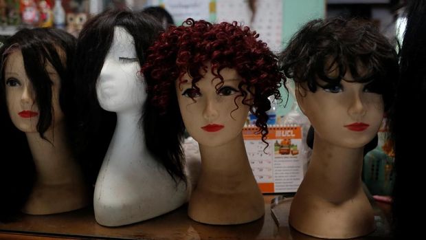 Real hair wigs are displayed at Tet Nay Lin Trading Co. in Yangon, Myanmar, June 19, 2018. Picture taken June 19, 2018. REUTERS/Ann Wang