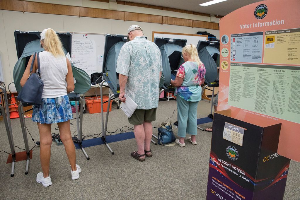 Voters line up to cast their ballots for the midterm elections at Newland Elementary School in the 48th Congressional District, Huntington Beach, California, U.S. November 6, 2018. REUTERS/Monica Almeida
