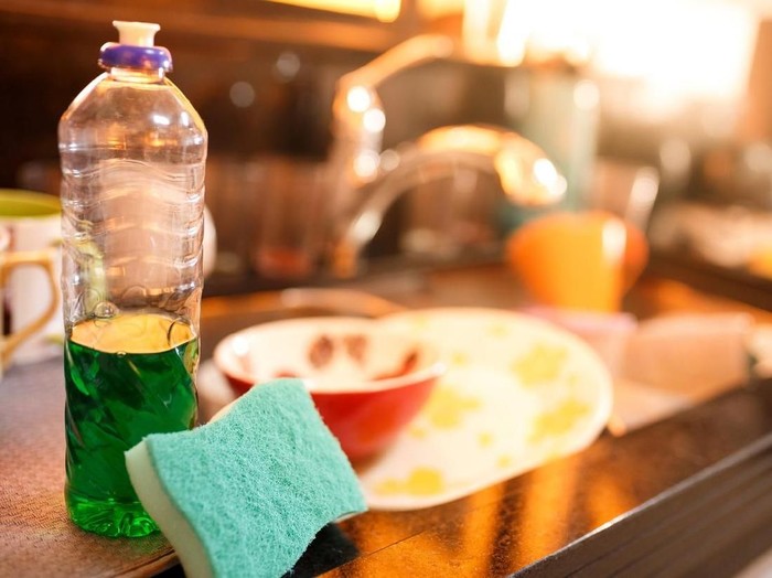 Dirty dishes in a messy sink
