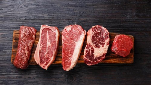 Variety of Raw Black Angus Prime meat steaks Machete, Blade on bone, Striploin, Rib eye, Tenderloin fillet mignon on wooden board copy space
