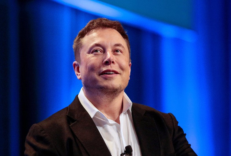 Tesla and SpaceX CEO Elon Musk smiles during a 