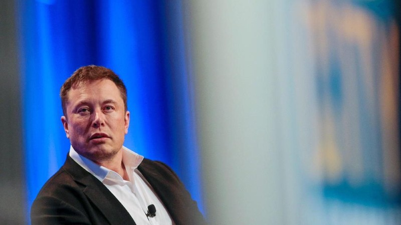 Tesla and SpaceX CEO Elon Musk smiles during a 