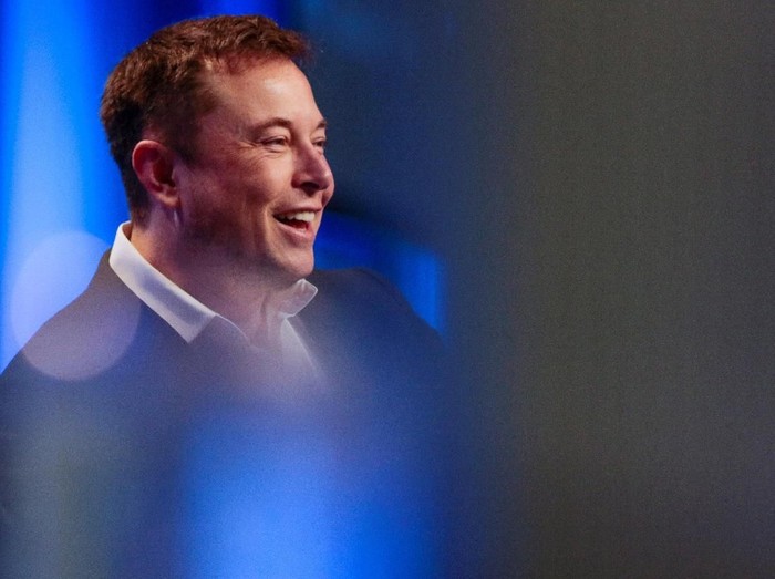 Tesla and SpaceX CEO Elon Musk smiles during a 