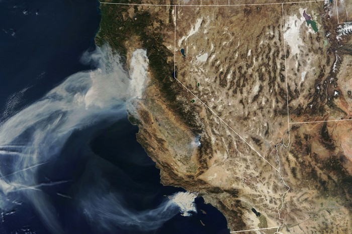 A NASAs Terra satellite image shows smoke continuing to spread west from the Camp Fire and two more fires, the Hill and Woolsey Fires in southern California, U.S., on November 9, 2018. Picture taken on November 9, 2018.  Courtesy NASA/Handout via REUTERS   ATTENTION EDITORS - THIS IMAGE HAS BEEN SUPPLIED BY A THIRD PARTY.
