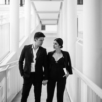 Dalam foto hitam-putih, Kat yang pernah bekerja di sebagai manager di Google bergaya maskulin sekaligus seksi, sementara Christian tampan bertuksedo. Foto: Instagram/@xtianbautista, @katramnani