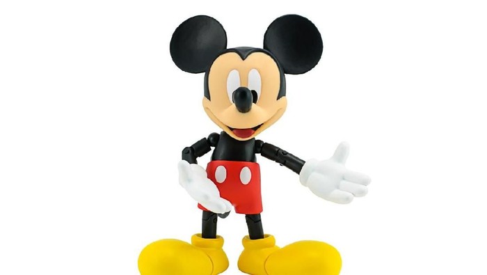 Bangkok, Thailand - January 6, 2015: Mickey Mouse action figure the official mascot of The Walt Disney Company. Mickey Mouse is a funny animal cartoon character was created by Walt Disney studio.