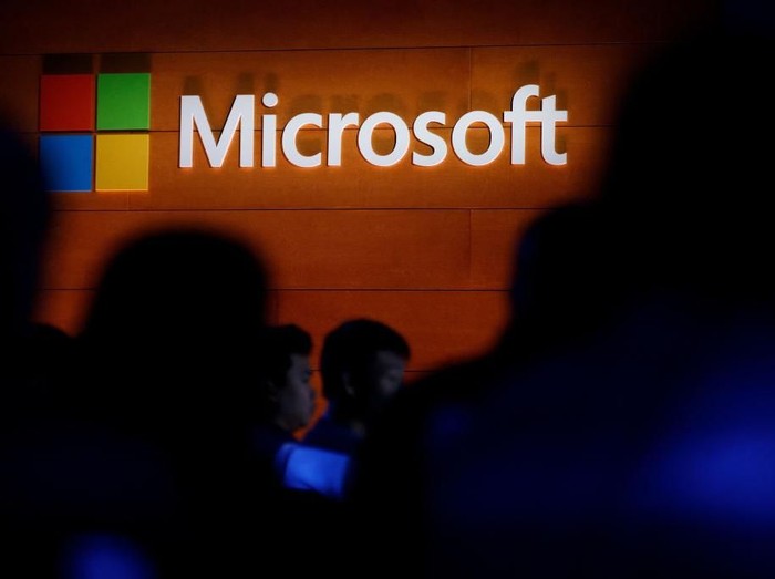 NEW YORK, NY - MAY 2: The Microsoft logo is illuminated on a wall during a Microsoft launch event to introduce the new Microsoft Surface laptop and Windows 10 S operating system, May 2, 2017 in New York City. The Windows 10 S operating system is geared toward the education market and is Microsofts answer to Googles Chrome OS. (Photo by Drew Angerer/Getty Images)