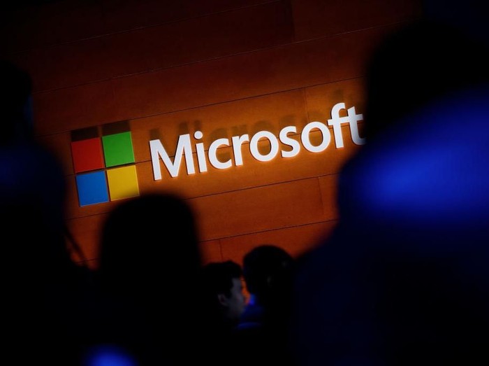 NEW YORK, NY - MAY 2: The Microsoft logo is illuminated on a wall during a Microsoft launch event to introduce the new Microsoft Surface laptop and Windows 10 S operating system, May 2, 2017 in New York City. The Windows 10 S operating system is geared toward the education market and is Microsofts answer to Googles Chrome OS. (Photo by Drew Angerer/Getty Images)