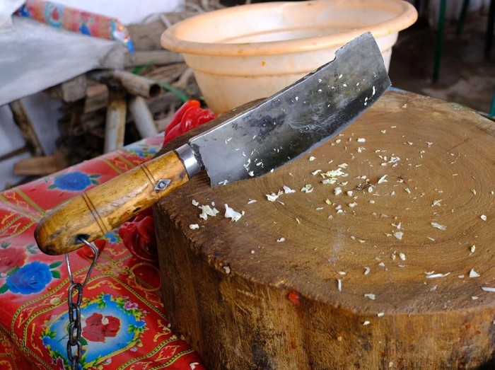 Butchers set for chopping meat: wooden block and chopper with rough handle