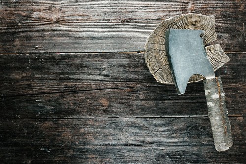 Butchers set for chopping meat: wooden block and chopper with rough handle