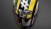 Helm ini adalah milik Andrea Iannone. Ia mengubah tampilan pelindung kepalanya menjadi motif kuning dan hitam, menyesuikan dengan motor Aprilia. (Foto: Instagram @motogp)