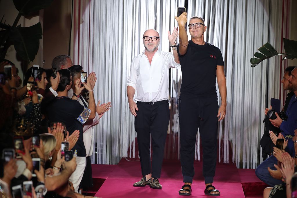 MILAN, ITALY - JUNE 16:  Designer Domenico Dolce and Stefano Gabbana acknowledge the applause of the audience at the Dolce & Gabbana Naked King Secret Show show during Milan Men's Fashion Week Spring/Summer 2019 on June 16, 2018 in Milan, Italy.  (Photo by Andreas Rentz/Getty Images)