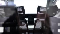 Terdapat 4 kursi dan 4 pintu didalam mobil listrik buatan David Omega ini yang ditenagai oleh baterai 14 kWh. Istimewa/dezeen.com.