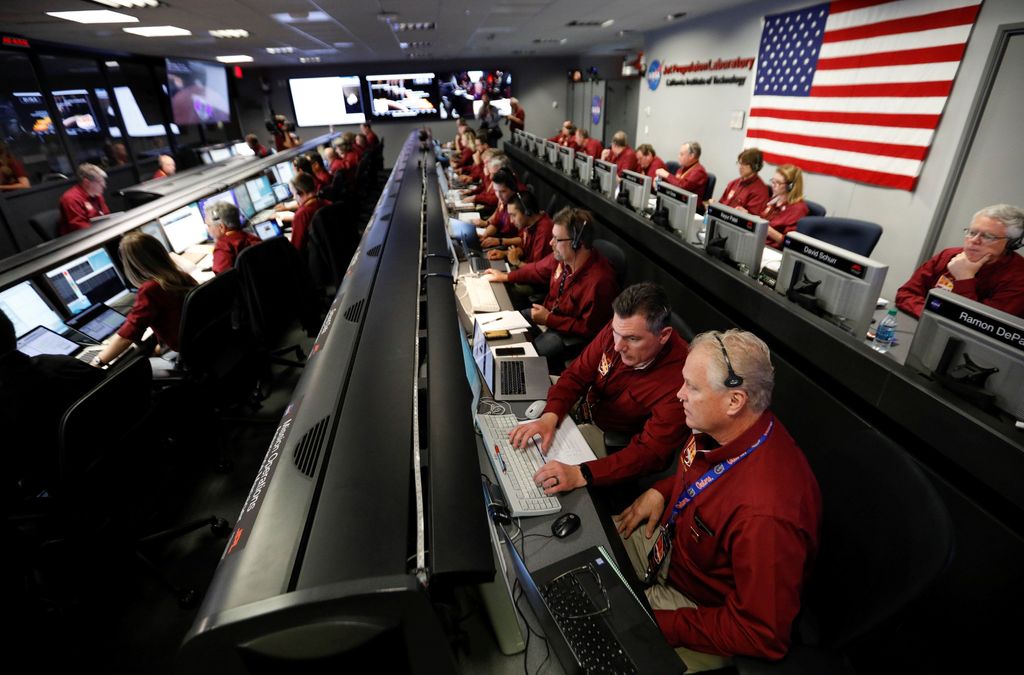 NASA engineers in the space flight operation facility at NASA's Jet Propulsion Laboratory (JPL) keep watch as the spaceship InSight, NASA's first robotic lander dedicated to studying the deep interior of Mars, prepares to land on the plant, from Pasadena, California, U.S. November 26, 2018.   Al Seib/Pool via REUTERS