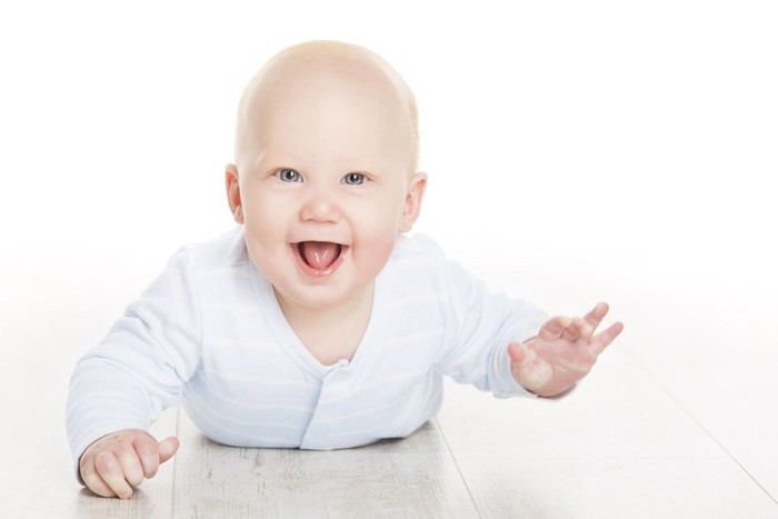 949384728 Happy Baby Boy, Infant Kid Lying on White Floor, Beautiful Six Months Old Child Isolated over White Background