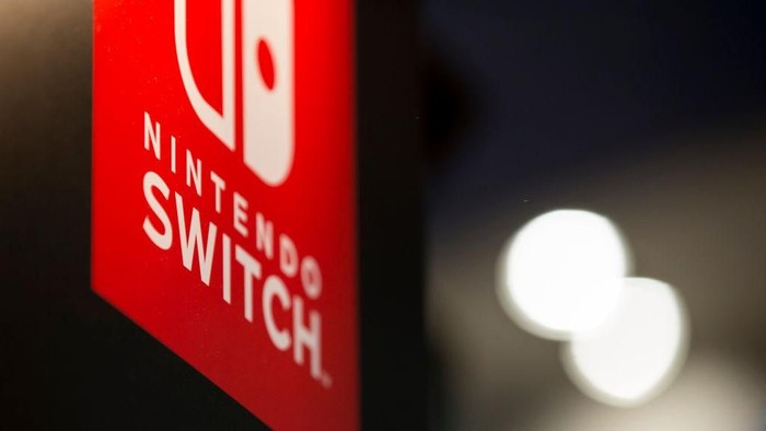 CHIBA, JAPAN - SEPTEMBER 21:  The logo of Nintendo Co.s Switch video game console is displayed in the Capcom Co. booth during the Tokyo Game Show 2017 at Makuhari Messe on September 21, 2017 in Chiba, Japan. The annual game show, which features games from 345 exhibitors for various platforms from game consoles to mobile phones, takes place September 21-24 and will feature eSports. (Photo by Tomohiro Ohsumi/Getty Images)