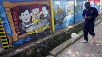 Mural ini memiliki pesan agar masyarakat tetap damai dan berteman meski berbeda pilihan pada Pilpres 2019.
