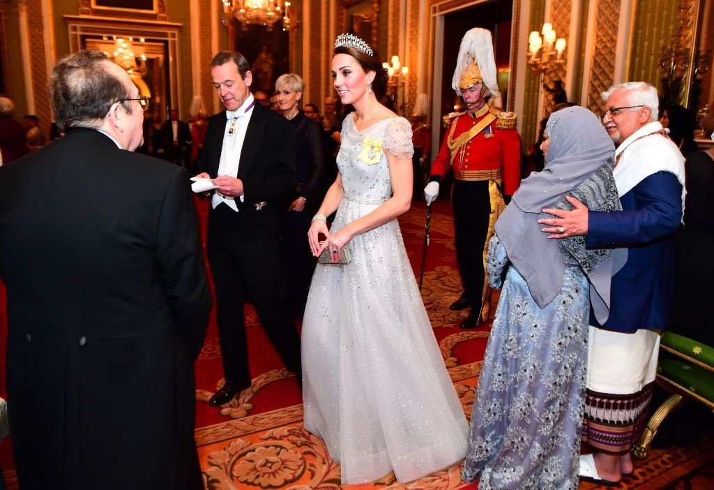 Kate Middleton LONDON, ENGLAND - DECEMBER 04: Catherine, Duchess of Cambridge greets guests at an evening reception for members of the Diplomatic Corps at Buckingham Palace on December 04, 2018 in London, England. Approximately 7,500 military personnel are currently serving overseas at Christmas. (Photo by Victoria Jones - WPA Pool/Getty Images)