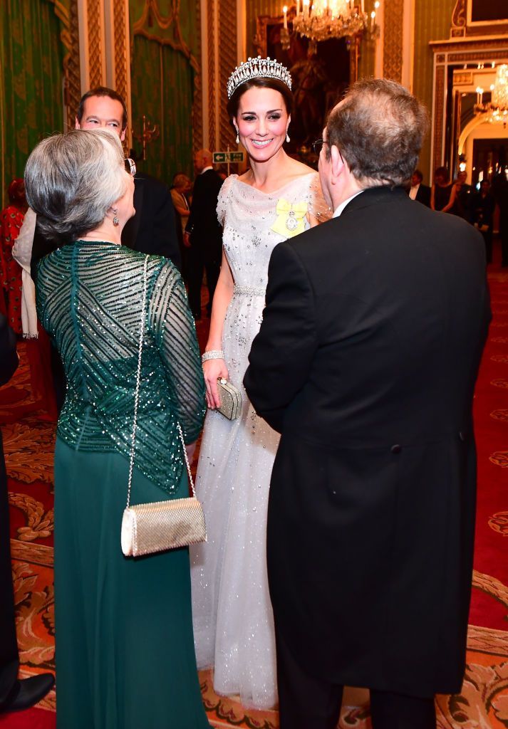 LONDON, ENGLAND - DECEMBER 04:   Catherine, Duchess of Cambridge greets guests at an evening reception for members of the Diplomatic Corps at Buckingham Palace on December 04, 2018 in London, England. Approximately 7,500 military personnel are currently serving overseas at Christmas.  (Photo by Victoria Jones - WPA Pool/Getty Images)