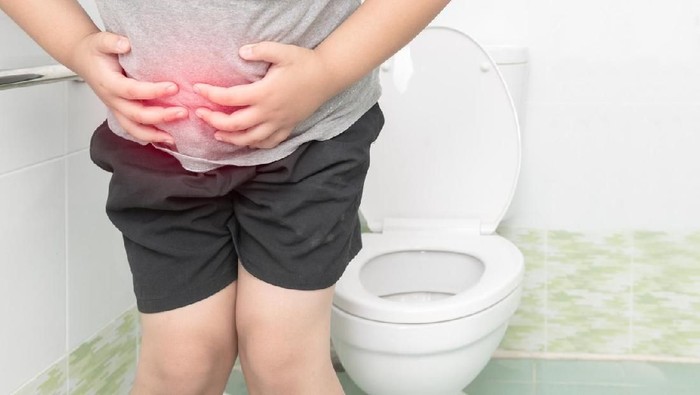 ilustrasi anak diare fat boy suffer stomach and sit in toilet, diarrhea constipation and health concept