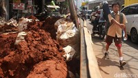 Galian kabel di sisi jalan terpaksa membuat para pejalan kaki harus ekstra hati-hati saat melintas.