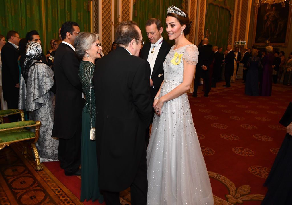 Kate Middleton LONDON, ENGLAND - DECEMBER 04: Catherine, Duchess of Cambridge greets guests at an evening reception for members of the Diplomatic Corps at Buckingham Palace on December 04, 2018 in London, England. Approximately 7,500 military personnel are currently serving overseas at Christmas. (Photo by Victoria Jones - WPA Pool/Getty Images)