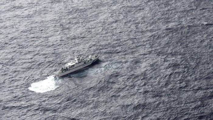 A Japan Coast Guard patrol vessel sails on the water at the area where two U.S. Marine Corps aircraft have been involved in a mishap in the skies, off the coast of Kochi prefecture, Japan, in this aerial view photo taken by Kyodo December 6, 2018.  Mandatory credit Kyodo/via REUTERS ATTENTION EDITORS - THIS IMAGE WAS PROVIDED BY A THIRD PARTY. MANDATORY CREDIT. JAPAN OUT. NO COMMERCIAL OR EDITORIAL SALES IN JAPAN.