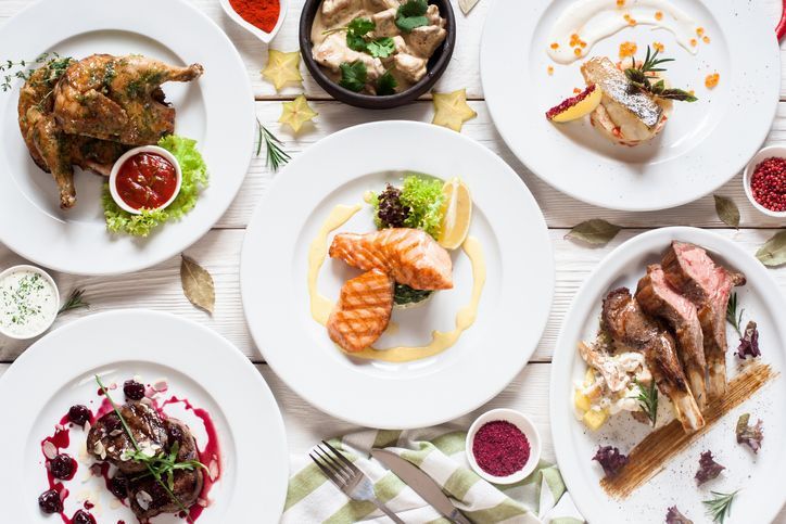 Fish and meat meals variety flat lay. Top view on buffet with assortment of healthy hearty food. Buffet, banquet, appetizer, restaurant menu concept