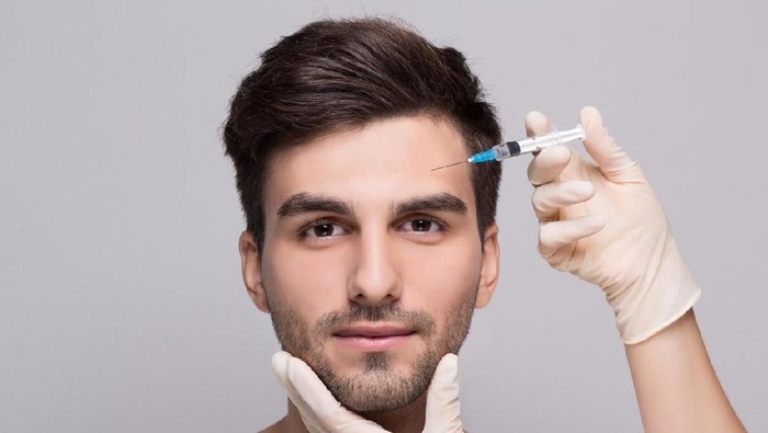Ilustrasi pria suntik filler. Foto: iStock Ilustrasi pria suntik filler. Foto: iStock