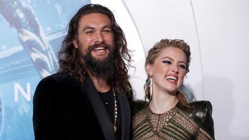 Amber bersama Jason Momoa yang berperan sebagai tokoh utama, yaitu Arthur Curry sang Aquaman. Ia naksir pada Mera. Foto: Reuters